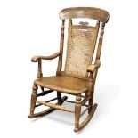 VINTAGE ROCKING CHAIR with cane and high back, 104 (h) x 62 (w) x 46cms (d) Provenance: private