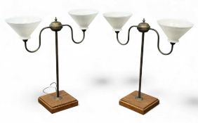 PAIR OF BRASS SHIP'S LAMPS, twin swan neck arms with conical white opaque glass shades, mounted on