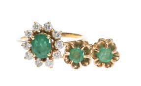 18CT GOLD EMERALD & DIAMOND CLUSTER RING, centred with an oval-cut emerald approx. 6 x 5mms,