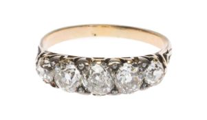 VICTORIAN FIVE-STONE DIAMOND RING in unmarked yellow metal, the graduated old European cut stones