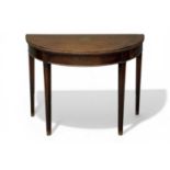 19TH CENTURY MAHOGANY DEMI-LUNE CARD TABLE, fold-over top with lined interior, on tapered square