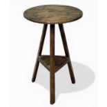 CHARACTERFUL OAK CIRCULAR-TOPPED CRICKET TABLE, with lower shelf, 19th century, 74 (h) x 49cms (