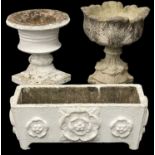 TWO COMPOSITE STONE GARDEN URNS, largest 60cms (h); white-painted composite plant trough, 30 (h) x