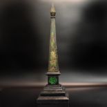 Obelisk. 19. Jh. | Schwarzer Onyx (?), Metall, farbig bemalt.