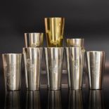 Acht Becher. Deutschland, 20. Jh., u.a. Bremen, Koch & Bergfeld | Silber, tlw. vergoldet.