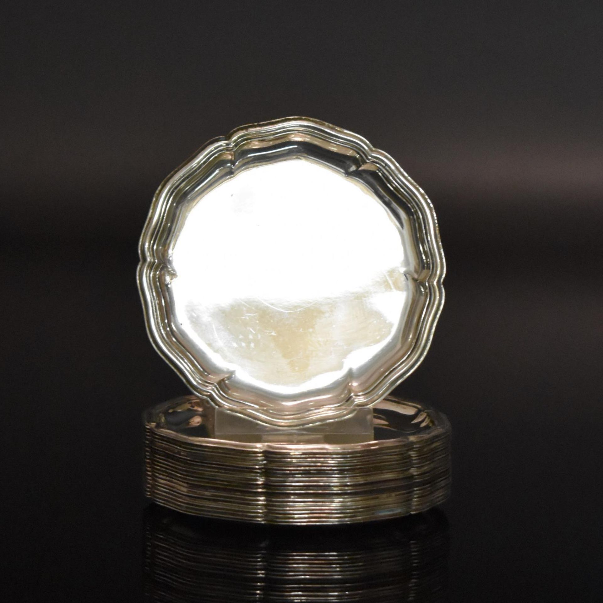 Satz von 20 kleinen Gläseruntersetzern. Bremen-Hemelingen, 20. Jh., Wilkens & Söhne | Silber.