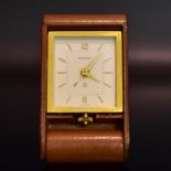 Reisewecker, Jaeger-leCoultre. Schweiz, Mitte 20. Jh. | Lederetui. Gehäuse: Messing.