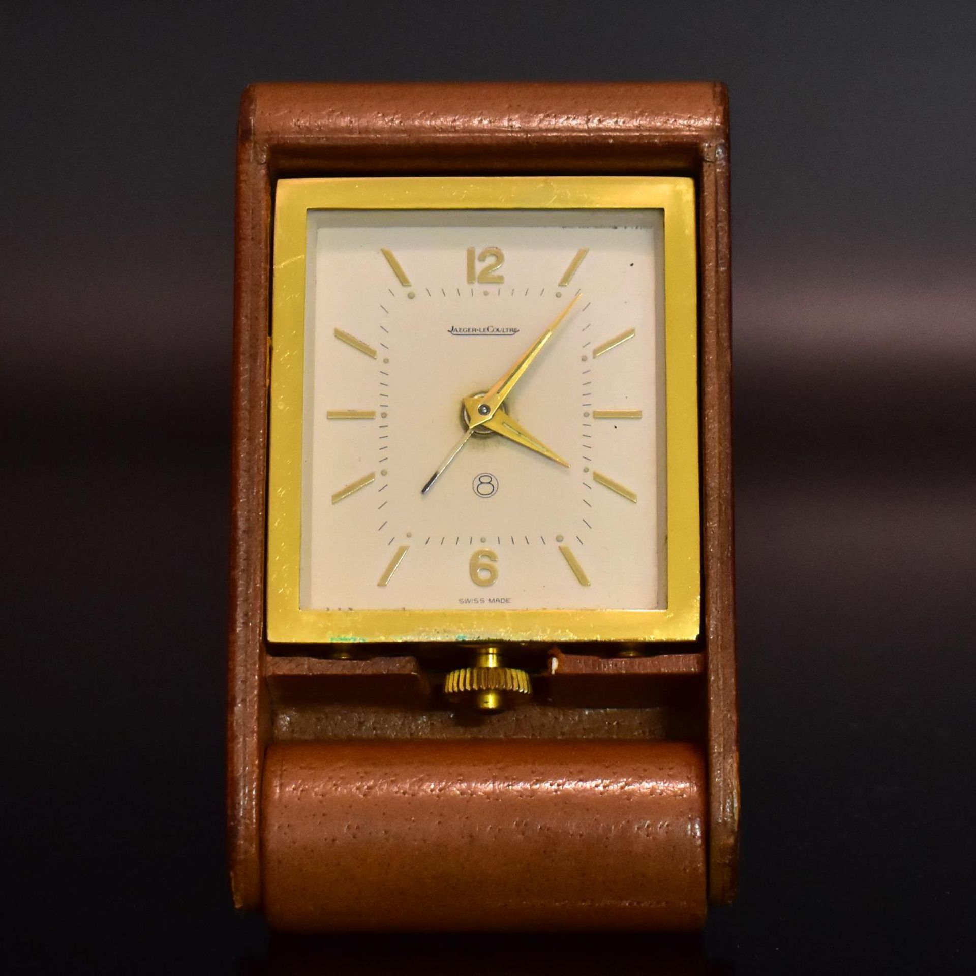 Reisewecker, Jaeger-leCoultre. Schweiz, Mitte 20. Jh. | Lederetui. Gehäuse: Messing.