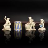 Zwei Putten, Wappenlöwe und Trommel. Nymphenburg | Porzellan, sparsam blau staffiert bzw. weiß.