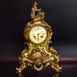 Kaminuhr. 19./20. Jh., Rokokostil | Gelbguss. Email. Glas.