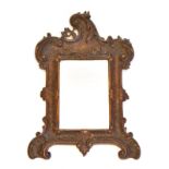 Kleiner Spiegel. 19./20. Jh., Rokokostil | Holz, geschnitzt. Spiegelglas.