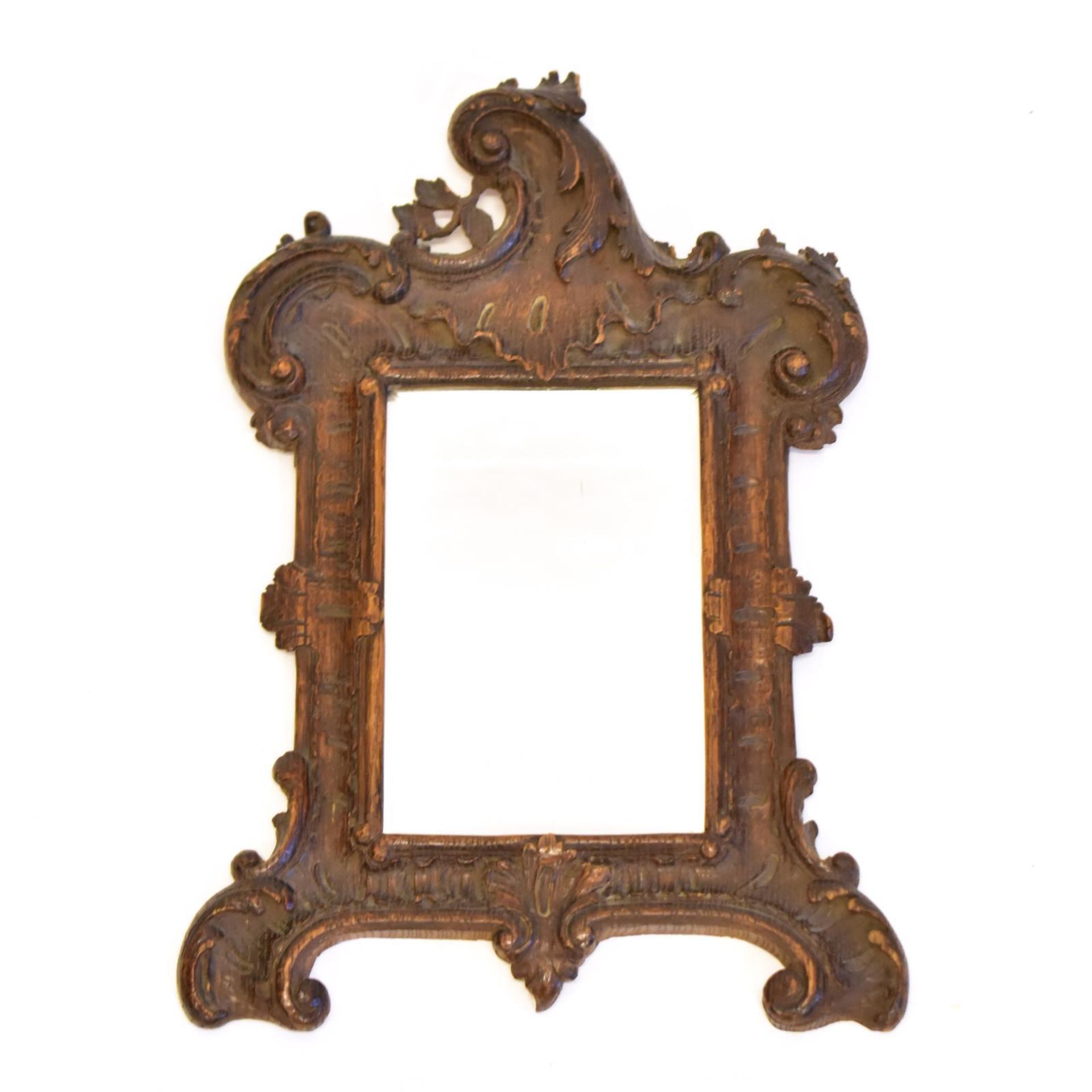 Kleiner Spiegel. 19./20. Jh., Rokokostil | Holz, geschnitzt. Spiegelglas.