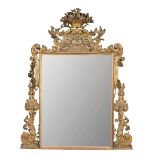 A carved, gilded and polychromed mirror, with a cornucopia pediment with parrots, flowers and swags