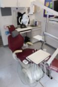 DCI Equipment dental chair with a Belmont medical light and a DCI instrument tray with instruments,