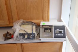 ProMix Dentsply dental amalgamator, model 400, serial #22363, and a Bobcat Cavitron model Gen-115
