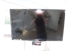 Philips flat screen television, model 32PFL4507, with Peerless arm wall mount