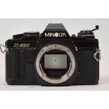 A Minolta X-500 SLR film camera, body only, together with three film cameras, bodies only, an
