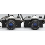 Two Fujica ST605N film cameras with Fujinon f/2.2 55mm lenses, together with three cameras, a