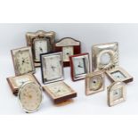 A quantity of twelve Italian silver desk clocks, all having quartz movements, largest measuring