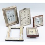 Four Italian silver desk clocks, having quartz movements, together with a silver frame lacking the