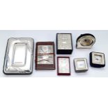 Three miniature Italian silver desk clocks, together with three Italian silver fronted notebooks,
