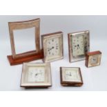 Five Italian silver desk clocks having quartz movements, together with a silver frame lacking the