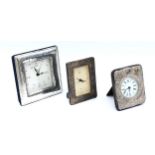 An embossed silver desk clock, London 1973, having quartz movement, together with  two Italian