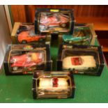 A group of five boxed Burago diecast model cars 1/18 scale, together with a 1/24 scale example, in