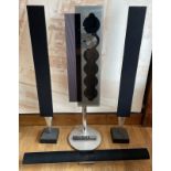 A Bang and Olufsen BeoSound 9000 6-disk CD player with remote and a pair of BeoLab 8000 floor-