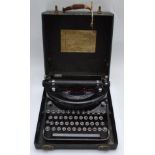 A Remington 'Noiseless' portable typewriter, number N108663, housed in it's original carry case