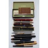 An 18ct gold nibbed Waterman fountain pen, with green marbled body, together various other