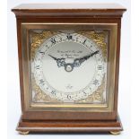 A mid 20th century Elliott bracket clock, mahogany cased with silvered chapter ring and Roman