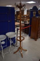 A late 19th or early 20th light mahogany hat stand, having Art Nouveau style hooks, height approx.