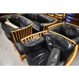 A vintage Ercol lounge suite in the comprising two settees and two chairs, together with similar