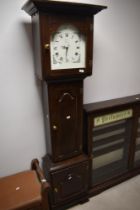A reproduction longcase clock , having quartz movement, shelved interior, height approx. 187cm