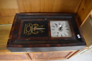 An American style wall clock printed Ansonia to interior of case