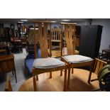 A vintage Ercol extending dining table and a set of six chairs in the Saville design