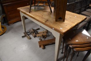 A traditional pine kitchen table having rustic top on painted frame, made by well reputed Maine