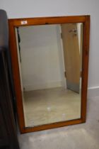 A stained frame wall mirror, approx. 84 x 53cm