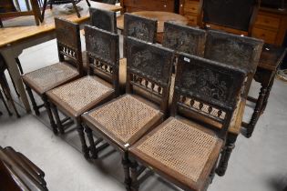 A set of eight 19th Century cane seated bedroom chairs having interesting embossed leather backs ,