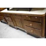 A Victorian scumbled pine sideboard having part painted top and ledge back, approx. W178