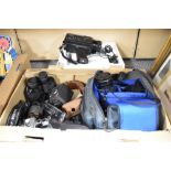 A Yashika FX-D quartz camera with 35-105mm zoom lens, a Minolta 7000 F camera with 35-70mm zoom