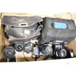 A group of three Minolta cameras and carry cases, XG-M with MD 35-70/35 lens, a Dynax 7XI with