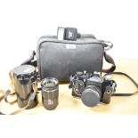 A Nikon F301 35mm film camera, a Tamron SP 35-210mm f 3.5-4.2 lens, a Revue DT-700S Zoom