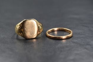 A gent's yellow metal signet ring of worn form stamped 9ct and a small 9ct rose gold wedding band,