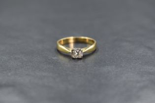 An 18ct gold diamond set solitaire ring, the princess cut diamond measuring approximately 0.24ct, in