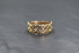A 9ct gold Celtic knot motif ring, of pierced interlocking design, marked 375, ring size W, 2.9g