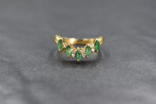 An 18ct gold emerald and diamond wishbone ring, the five marquise cut emeralds, total approx 0.