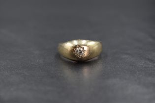 A 9ct gold diamond set gypsy ring, the round brilliant cut diamond measuring approximately 0.25ct,