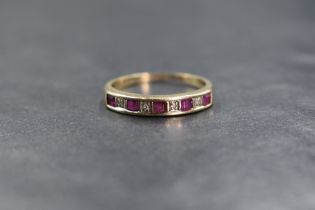 A 9ct gold ruby and diamond set half eternity, the five princess cut rubies interspersed with four